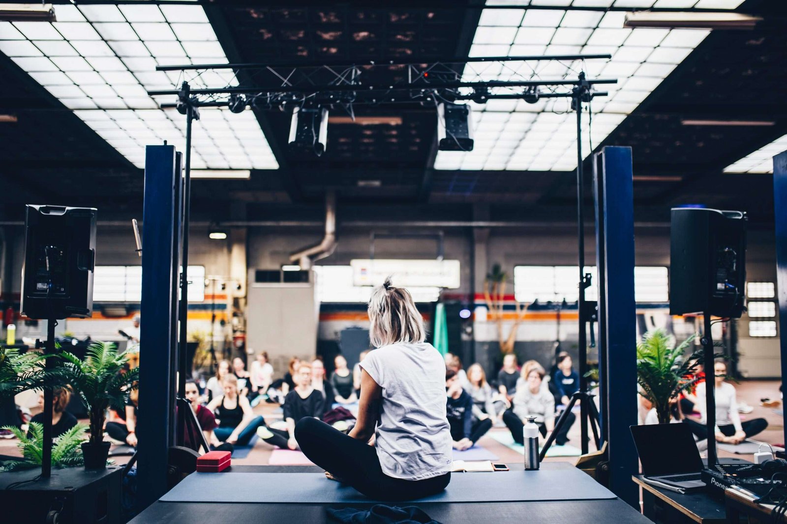 woman sitting in the yoga mat